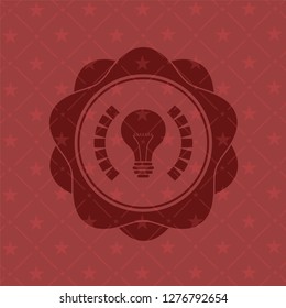 light bulb icon inside red emblem. Retro