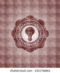 light bulb icon inside red emblem or badge with abstract geometric polygonal pattern background. Seamless.