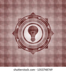 light bulb icon inside red seamless emblem or badge with geometric pattern background.