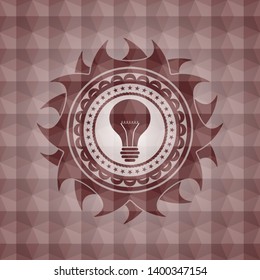 light bulb icon inside red seamless emblem or badge with abstract geometric polygonal pattern background.