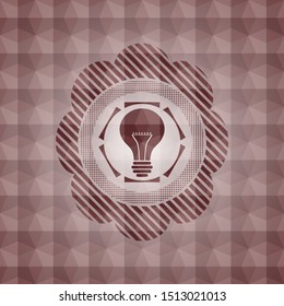 light bulb icon inside red emblem or badge with geometric pattern background. Seamless.