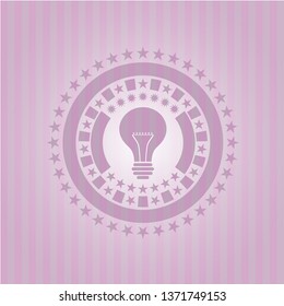 light bulb icon inside retro style pink emblem
