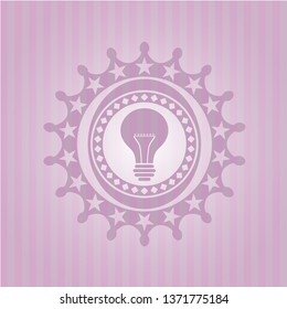 light bulb icon inside retro style pink emblem