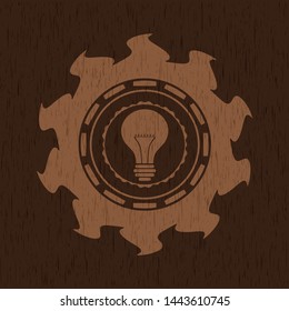 light bulb icon inside retro wood emblem