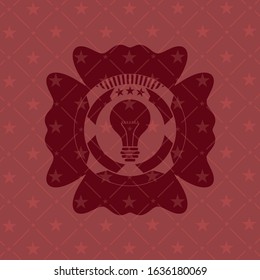 light bulb icon inside retro style red emblem