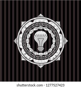light bulb icon inside silver badge or emblem