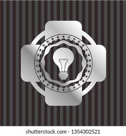light bulb icon inside silver emblem