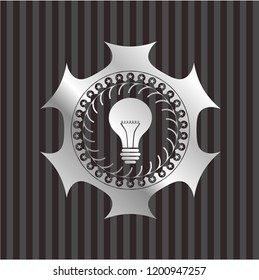 light bulb icon inside silvery emblem or badge