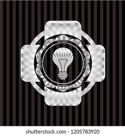 light bulb icon inside silvery shiny emblem