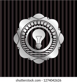 light bulb icon inside silvery shiny emblem