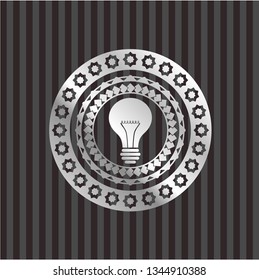 light bulb icon inside silvery shiny emblem
