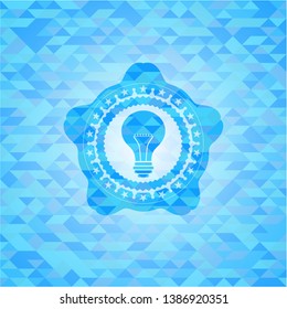 light bulb icon inside sky blue emblem. Mosaic background