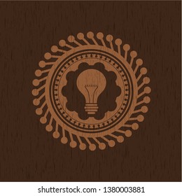 light bulb icon inside vintage wood emblem