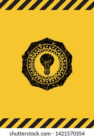 light bulb icon inside warning sign, black grunge emblem. Vector Illustration. Detailed.