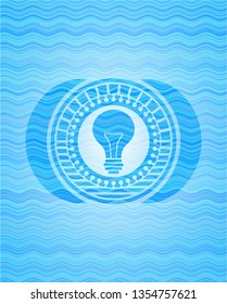 light bulb icon inside water wave badge.