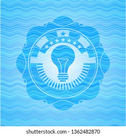 light bulb icon inside water representation style badge.