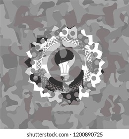 light bulb icon on grey camo texture