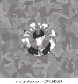 light bulb icon on grey camo texture