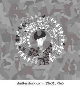 light bulb icon on grey camo pattern