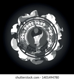 light bulb icon on grey camo pattern