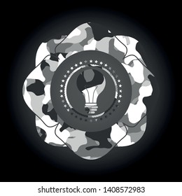 light bulb icon on grey camouflaged pattern