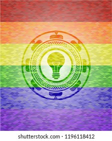 light bulb icon on mosaic background with the colors of the LGBT flag