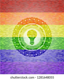 light bulb icon on mosaic background with the colors of the LGBT flag