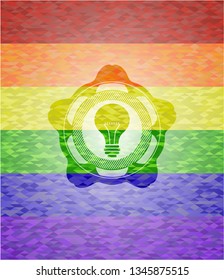 light bulb icon on mosaic background with the colors of the LGBT flag