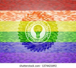light bulb icon on mosaic background with the colors of the LGBT flag