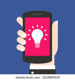 Light bulb icon on smartphone screen. Hand holding smartphone. Answer the call. Modern concept for web banners, web sites, infographics. Flat design vector illustration.