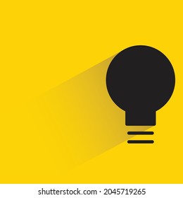 light bulb icon with shadow on yellow background