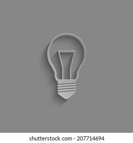 Light bulb icon with shadow on a grey background