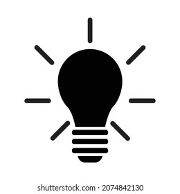 Icono de la bombilla. Un símbolo de una idea. La silueta de una bombilla incandescente con rayos de luz. Ilustración vectorial aislada en un fondo blanco para el diseño y la web.