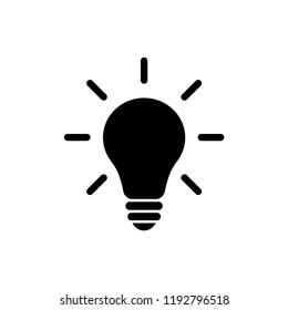 Light bulb idea concept vector icon. Lightbulb with rays glowing flat glyph icon.
