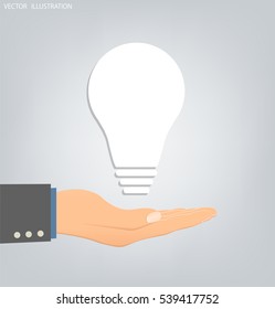 Light bulb idea on an open palm. Electric lamp in his hand. White light bulb. Light bulb in hand on gray background. Vector illustration modern template design.