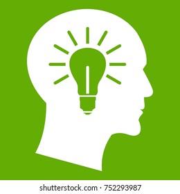 Light bulb inside head icon white isolated on green background. Vector illustration