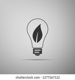 Light bulb with leaf icon isolated on grey background. Eco energy concept. Flat design. Vector Illustration