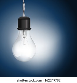 light bulb lighting on blue background 