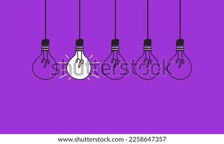 Light bulb next to other bulbs on a purple background. Concept of women's leadership in the world of work. Enterprising women.