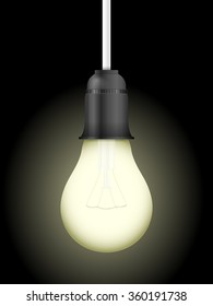 Light bulb on a black background.