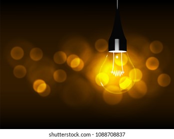 light bulb over gold bokeh 