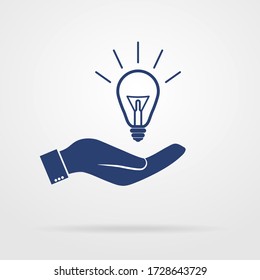 Light bulb in the palm of your hand, vector icon. eps 10