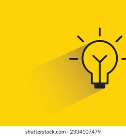 light bulb with shadow on yellow background