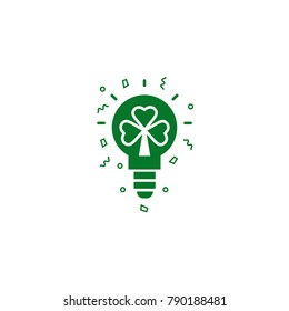 Light bulb with shamrock symbol - flat vector silhouette on isolated background. Lighting lamp with rays ans clover sign into it. Illustration of luck, fortune and Saint Patrick's Day celebration. 