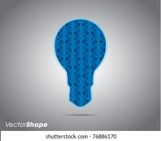 Light bulb silhouette made of puzzle pieces, business teamwork concept, vector illustration