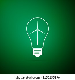 Light bulb with a wind turbines as idea of eco-friendly source of energy icon isolated on green background. Flat design. Vector Illustration