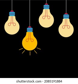 Light bulbs hanging on a set of incandescent filaments. One glows the brightest on a black background.