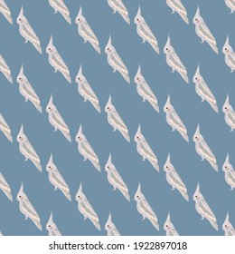 Light cockatoo parrot hand drawn seamless pattern in doodle style. Blue background. Exotic bird print. Flat vector print for textile, fabric, giftwrap, wallpapers. Endless illustration.