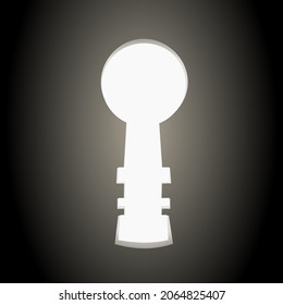 Light coming out of a keyhole against a black background