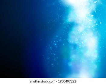 Light in darkness. Bokeh and sparkles on the background. Vector.